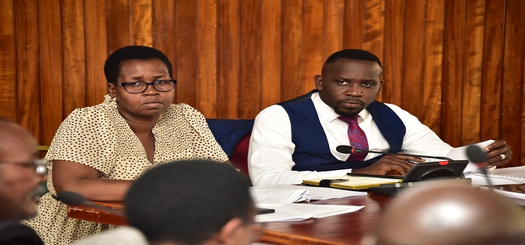 Committee chairperson, Hon. Ssenyonyi (R) with his deputy, Hon. Lucy Akello during the meeting